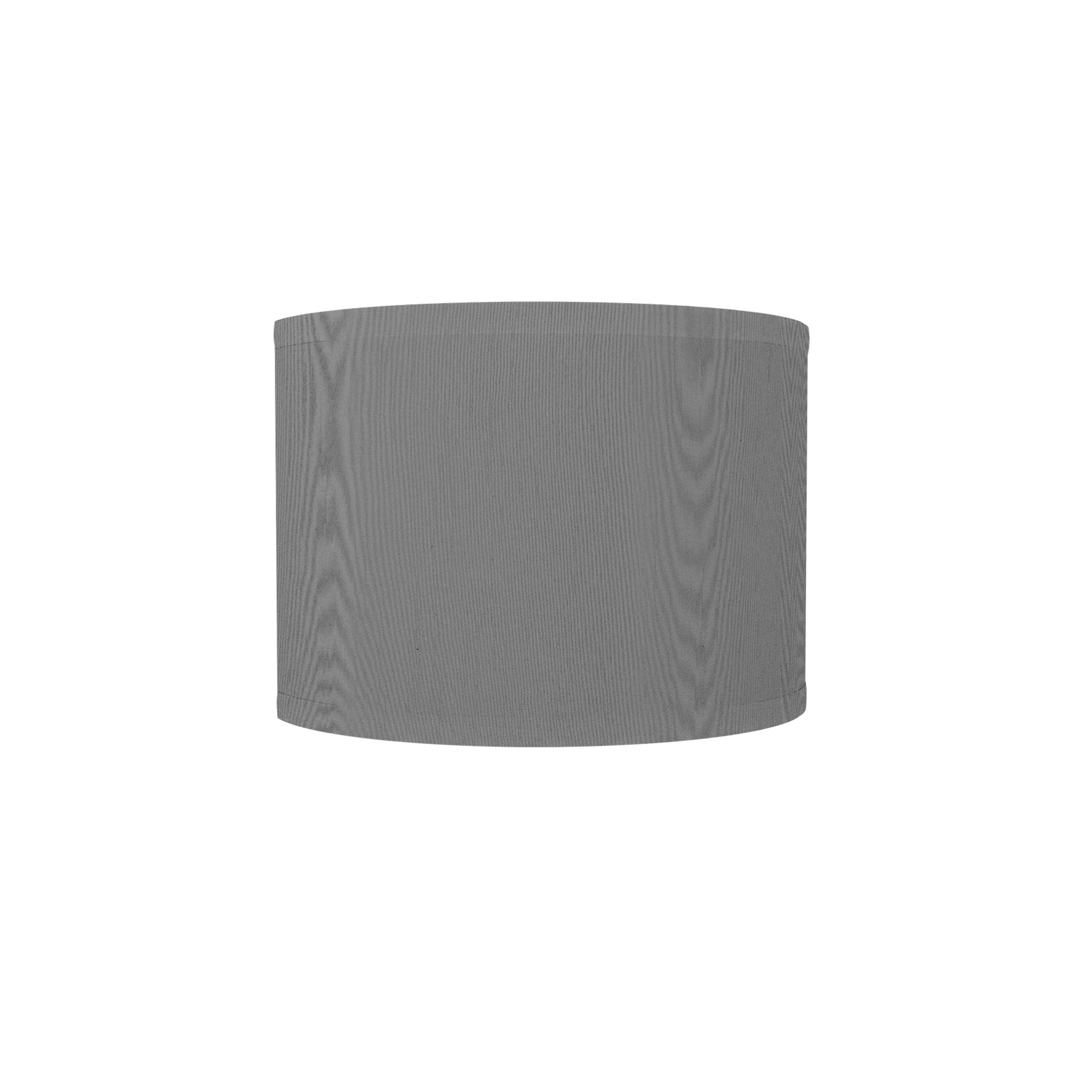 The Bryce Wall Sconce from Seascape Fixtures with a silk shade in gunmetal color.