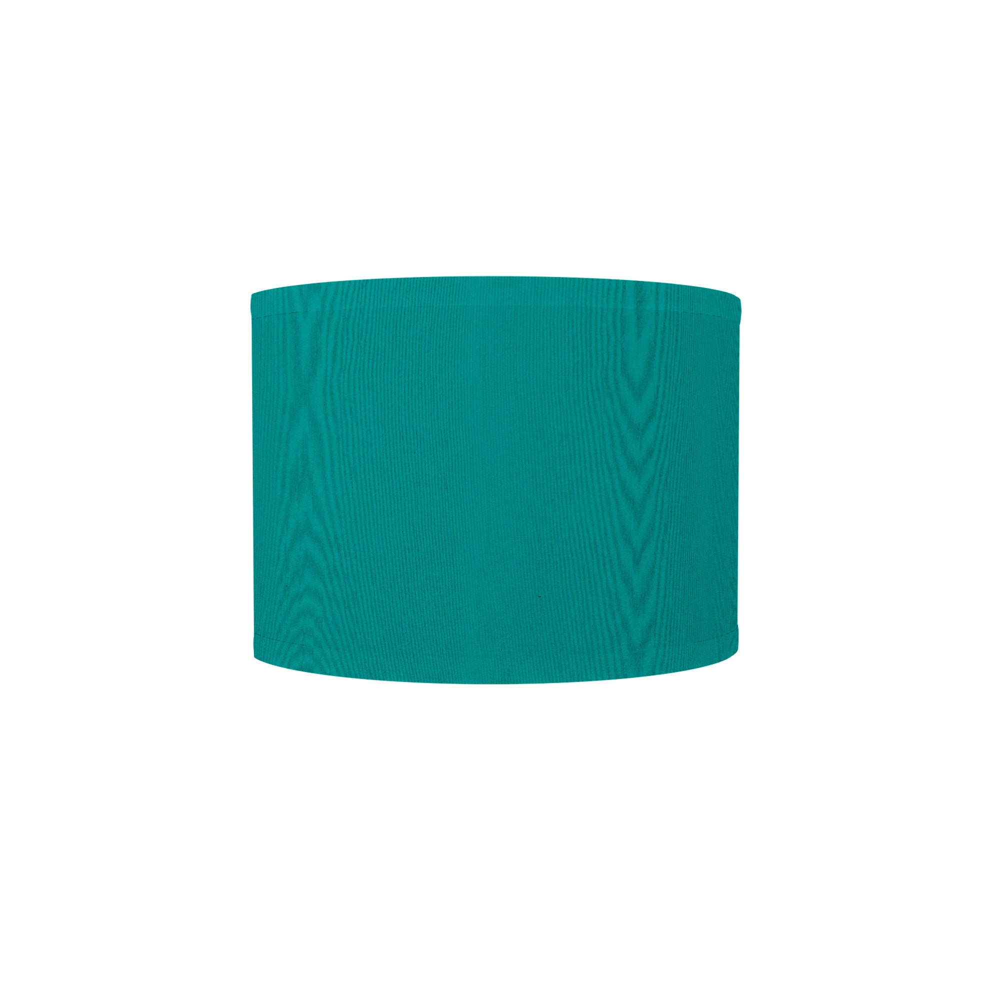 The Bryce Wall Sconce from Seascape Fixtures with a silk shade in turquoise color.