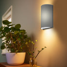 The Myra Wall Sconce from Seascape Fixtures in a living room lifestyle photograph.