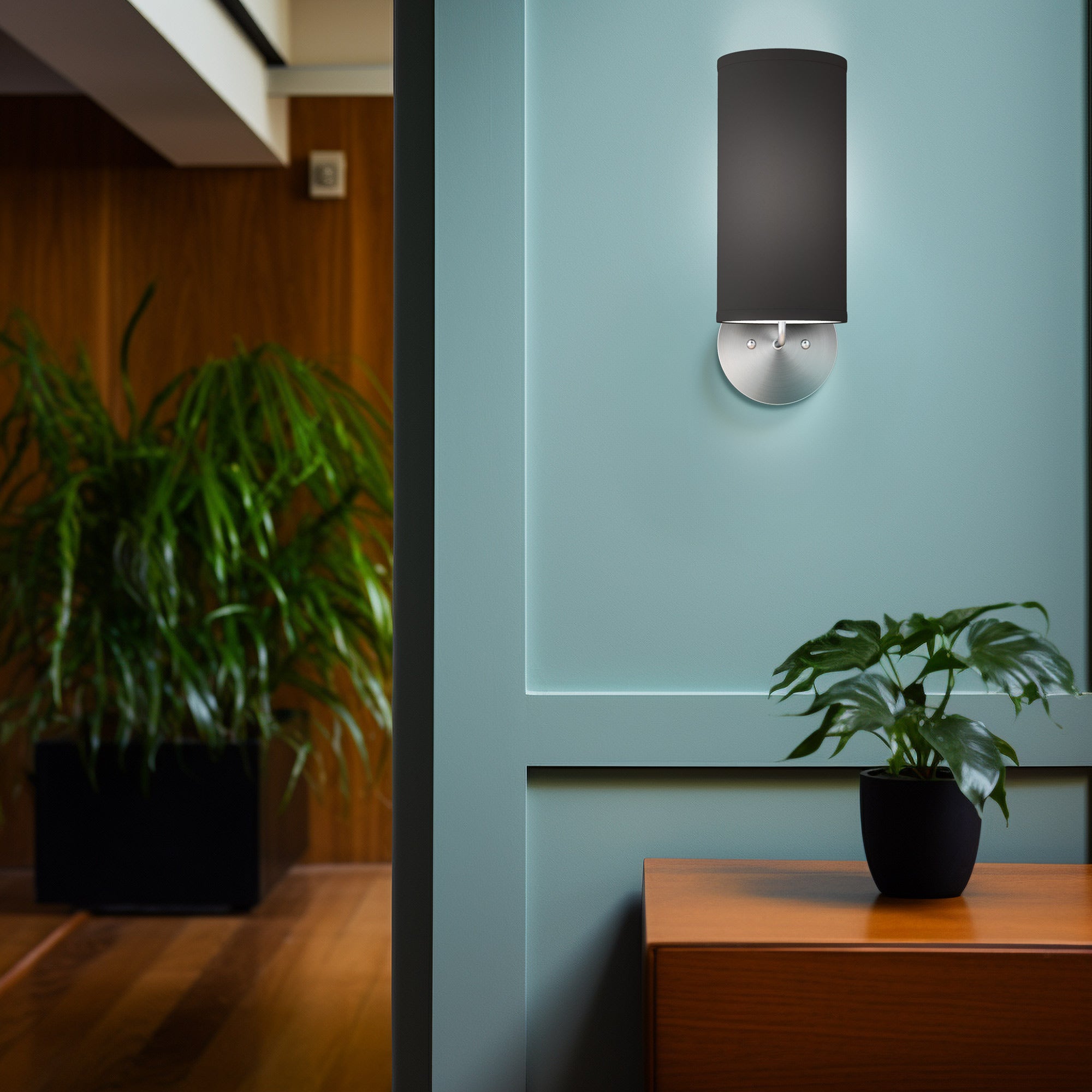 The Uma Wall Sconce from Seascape Fixtures in a living room lifestyle photograph.